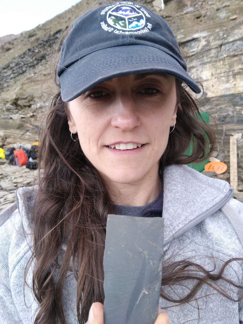 August 2017: Sophie Archambeault takes a family photo with a fossil of the stem chordate Pikaia gracilens at the Burgess Shale, Canada.