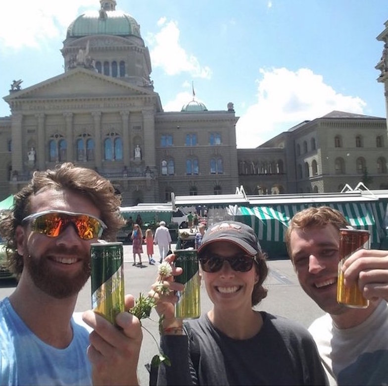 June 2018: Matt Josephson, Diana Rennison, and Matt Zuellig enjoy a refreshment at the Bundesplatz in Bern after a sunny day of collecting clover for the Global Urban Evolution Project (GLUE).